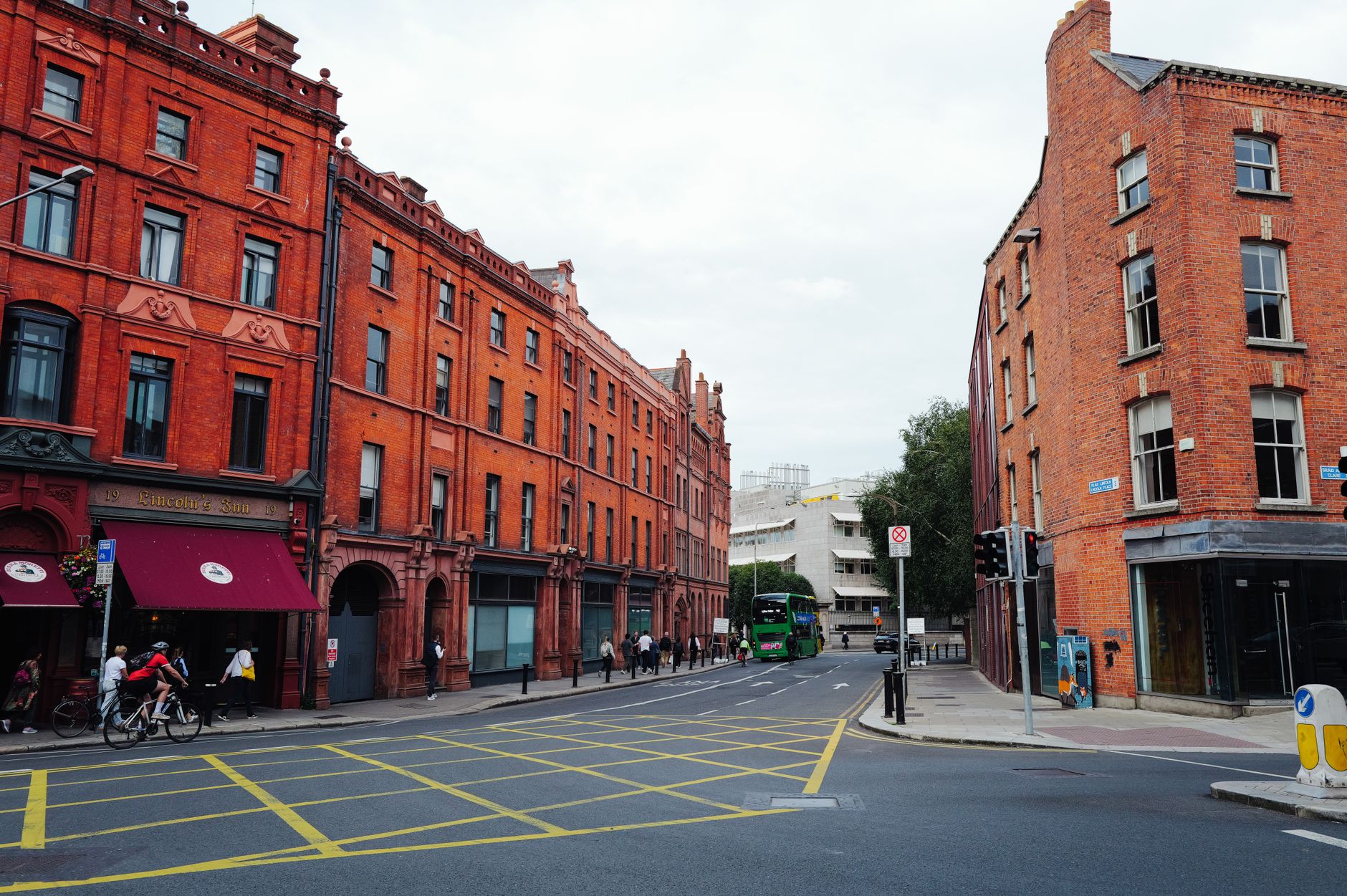 A busy Dublin city street with traffic and a bus