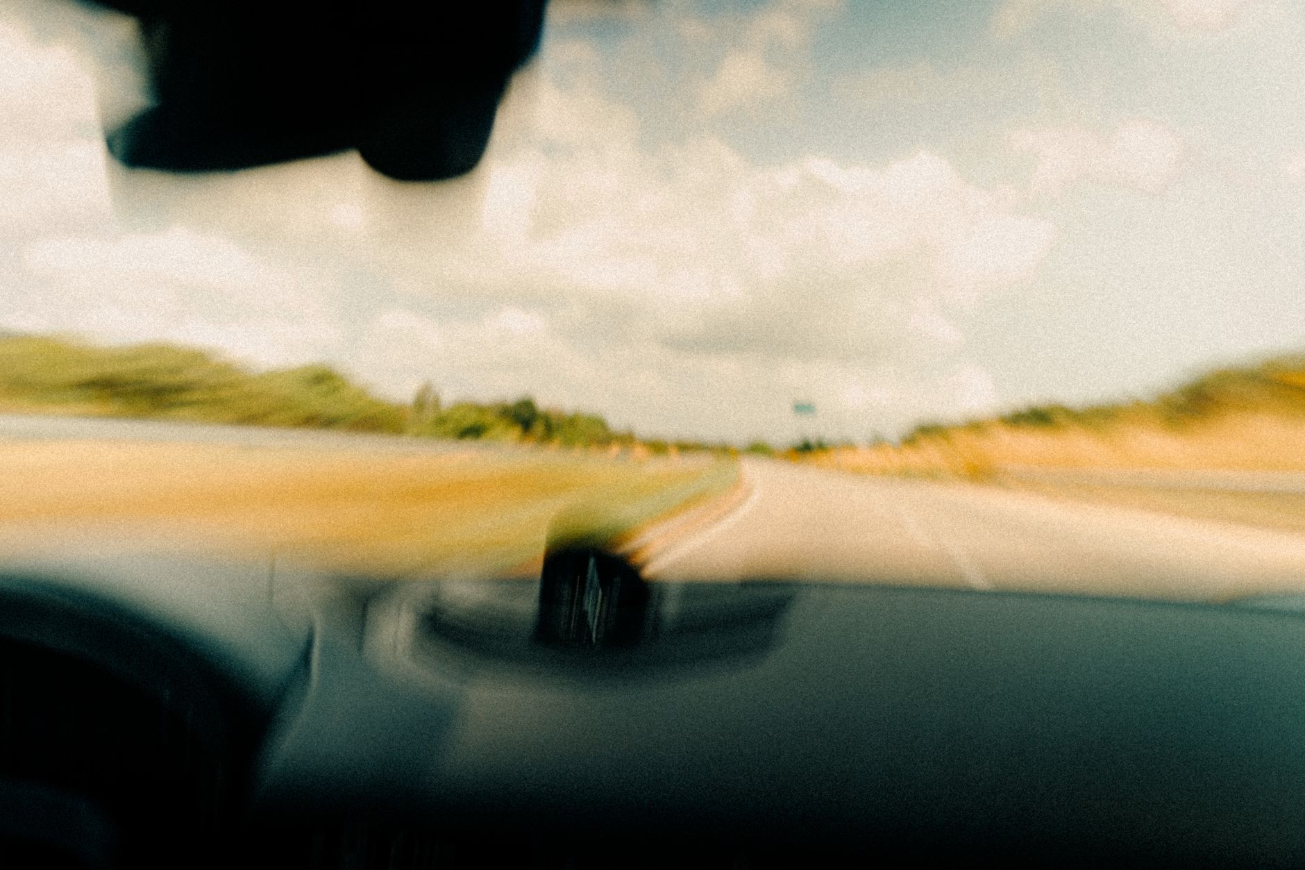 Cars moving at speed on a road
